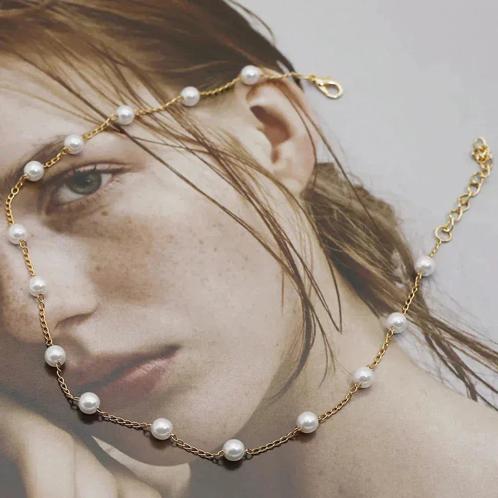 Layered Gold Necklace Adorned with a Pearl Accent